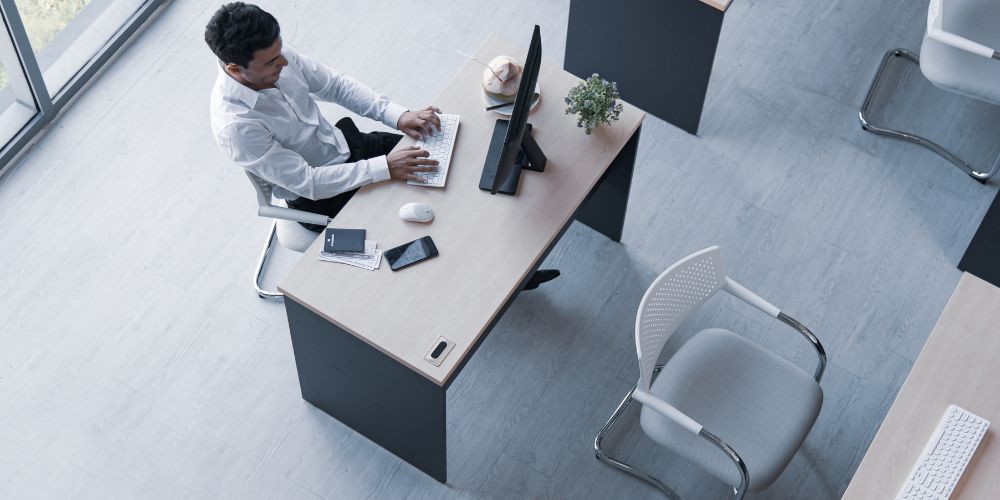 employee noticing dirty workspace