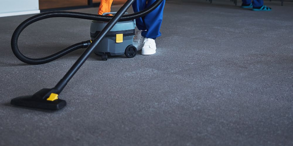 Commercial rubber floor being cleaned with a floor machine